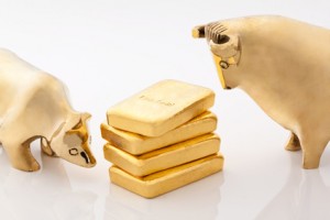 Bulle und Bär. Börsen Symbole mit Goldbarren